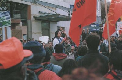 A speaker addresses marchers during the march through downtown Seattle.